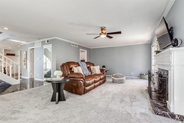 carpeted living room featuring ceiling fan and crown molding