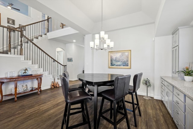 dining space with a chandelier and dark hardwood / wood-style flooring