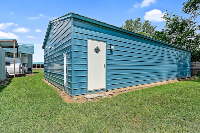 view of outdoor structure featuring a yard