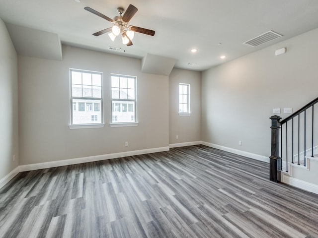 spare room with ceiling fan and wood-type flooring