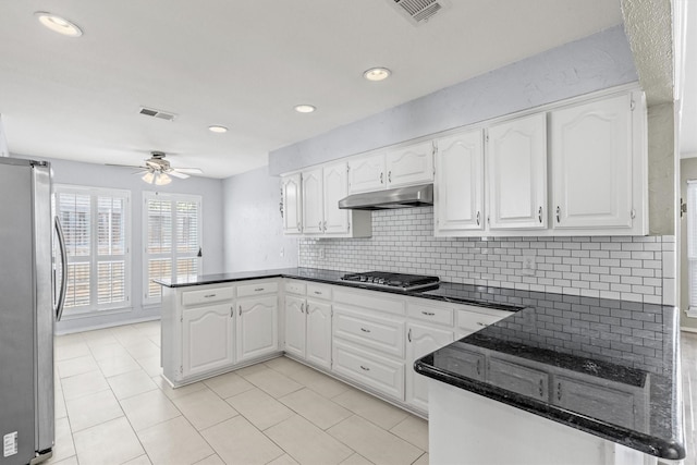 kitchen featuring white cabinetry, kitchen peninsula, and stainless steel appliances