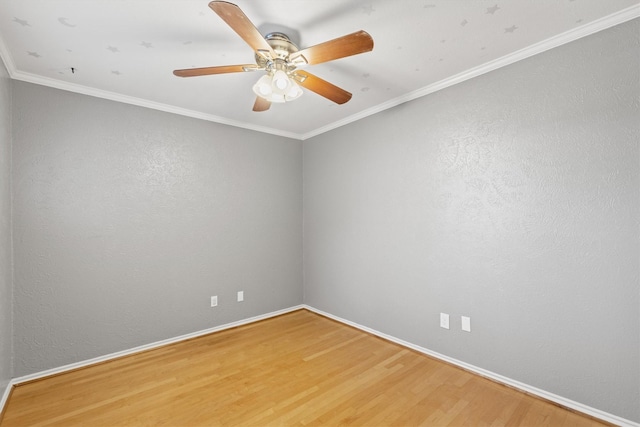 unfurnished room with hardwood / wood-style flooring, ceiling fan, and crown molding