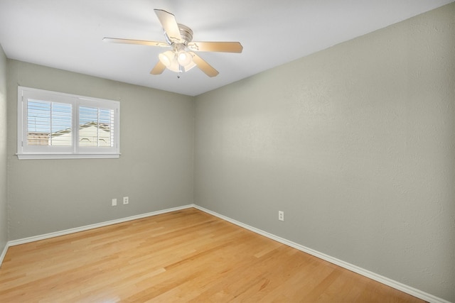 unfurnished room with ceiling fan and wood-type flooring