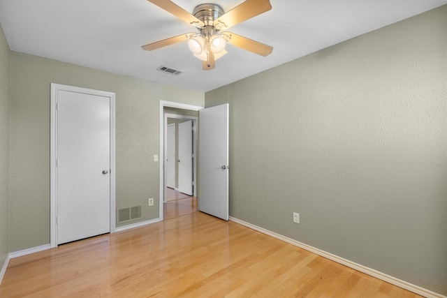 unfurnished bedroom featuring ceiling fan and light hardwood / wood-style flooring