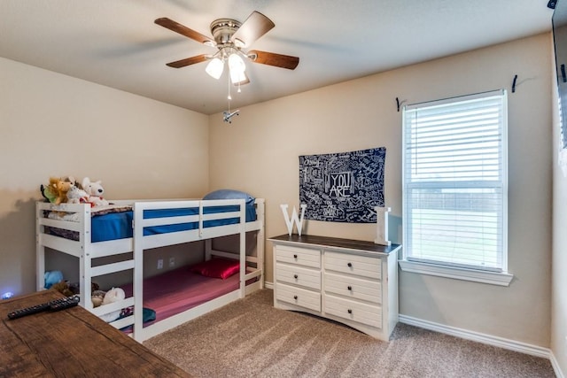 bedroom with ceiling fan and carpet floors