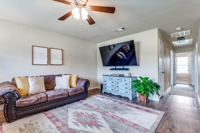 living room with ceiling fan and wood-type flooring