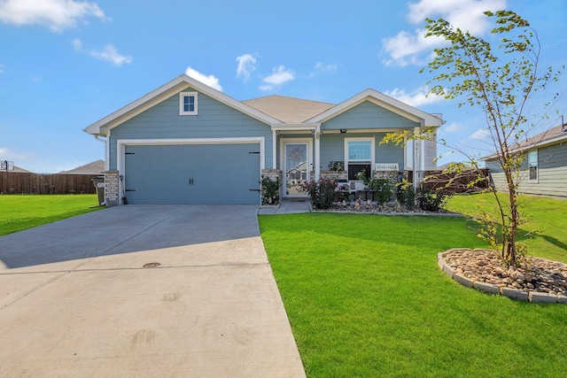 craftsman house featuring driveway, an attached garage, a front lawn, and fence