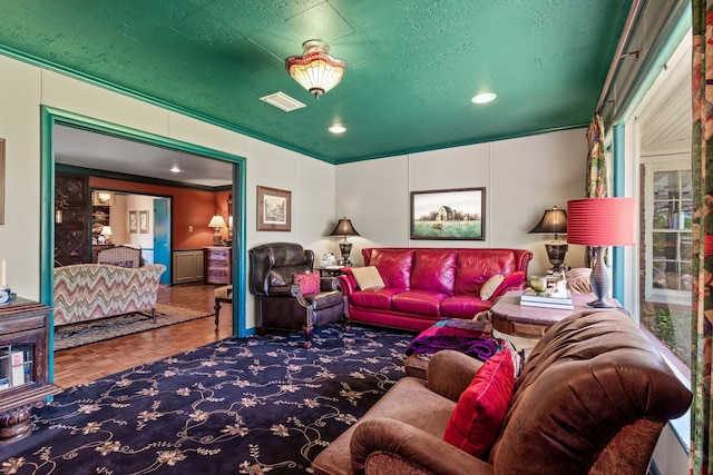 living room featuring parquet flooring and crown molding