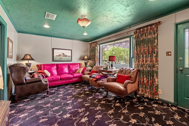 living room with crown molding and carpet flooring