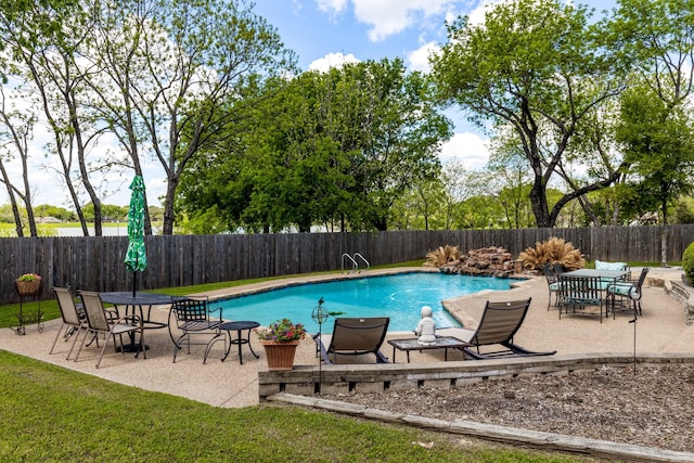 view of pool featuring a patio and pool water feature