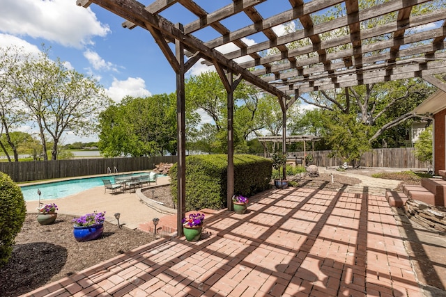 view of patio / terrace featuring a pergola and a fenced in pool