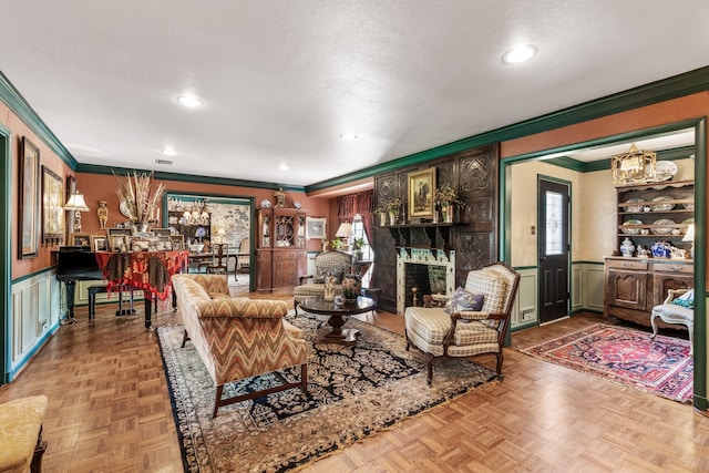 living room featuring crown molding, parquet floors, and a textured ceiling