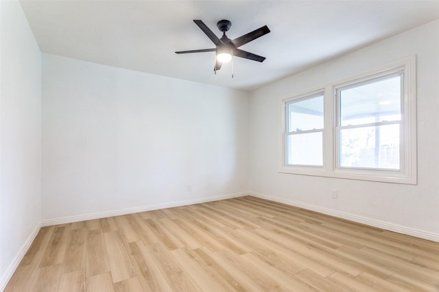 spare room featuring ceiling fan and light hardwood / wood-style flooring