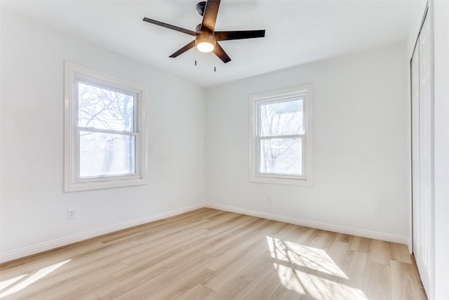 unfurnished room featuring ceiling fan and light wood-type flooring