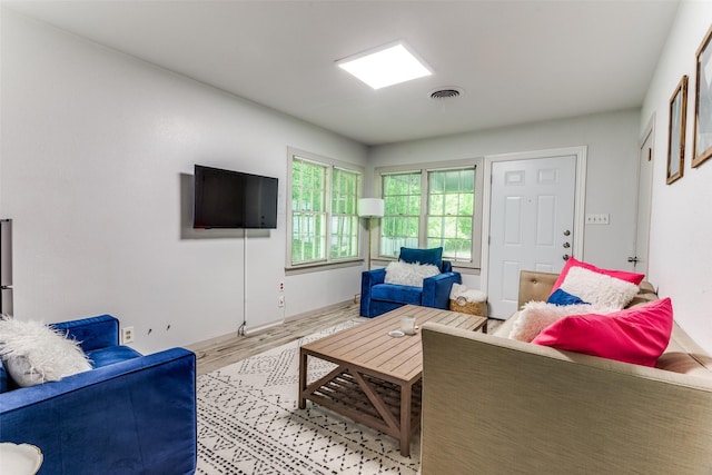 living room with light hardwood / wood-style floors