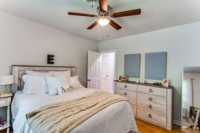 bedroom featuring light hardwood / wood-style flooring and ceiling fan