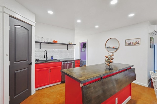 kitchen featuring sink, a center island, a wall unit AC, stainless steel dishwasher, and tasteful backsplash