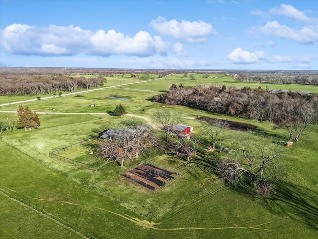 birds eye view of property with a rural view