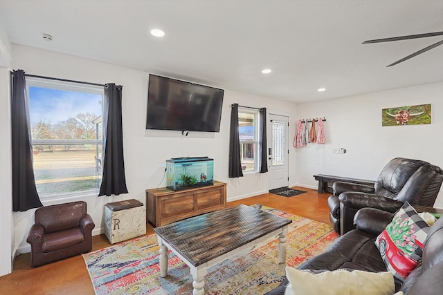 living room featuring ceiling fan and wood-type flooring