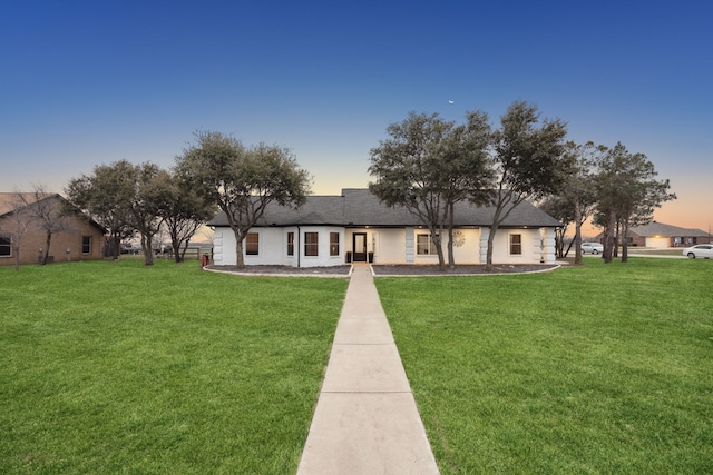 view of front facade with a front lawn