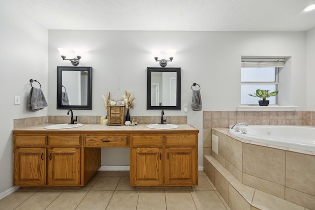 full bathroom featuring double vanity, a sink, and tile patterned floors