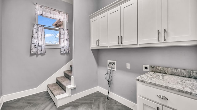 114 N Star Crossing Ln, Weatherford, TX 76088 - laundry area with cabinet space, washer hookup, baseboards, and electric dryer hookup
