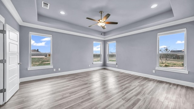 114 N Star Crossing Ln, Weatherford, TX 76088 - empty room with a raised ceiling, a ceiling fan, and a healthy amount of sunlight