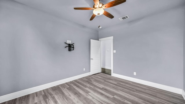 114 N Star Crossing Ln, Weatherford, TX 76088 - spare room featuring baseboards, a ceiling fan, visible vents, and wood finished floors