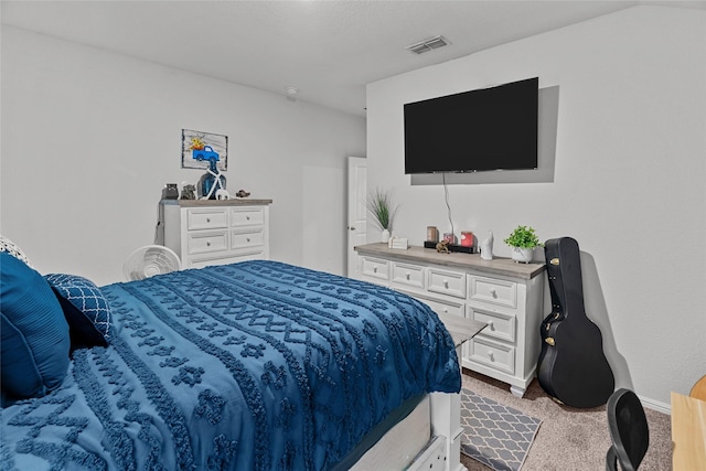 bedroom featuring light colored carpet