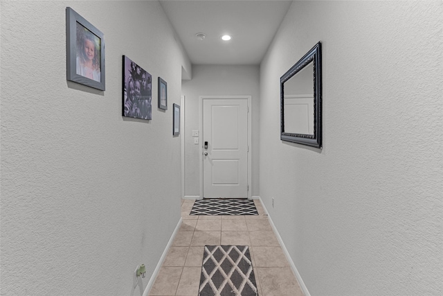 hallway featuring light tile patterned floors