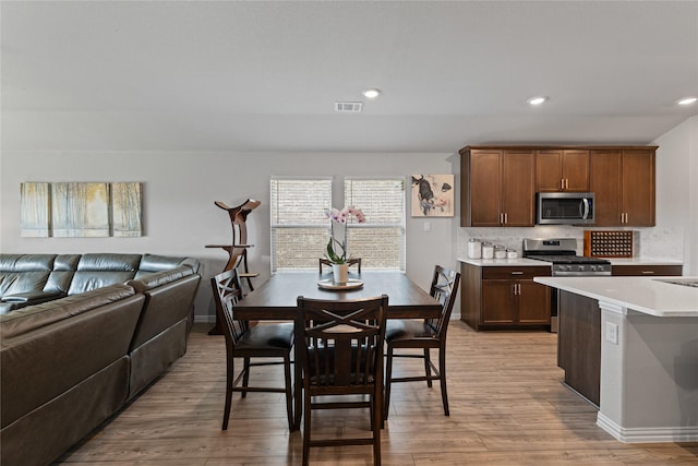 dining space featuring light hardwood / wood-style floors