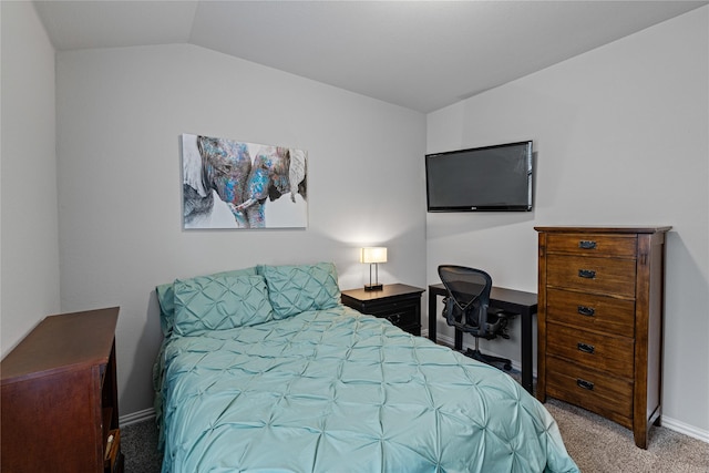 carpeted bedroom featuring lofted ceiling