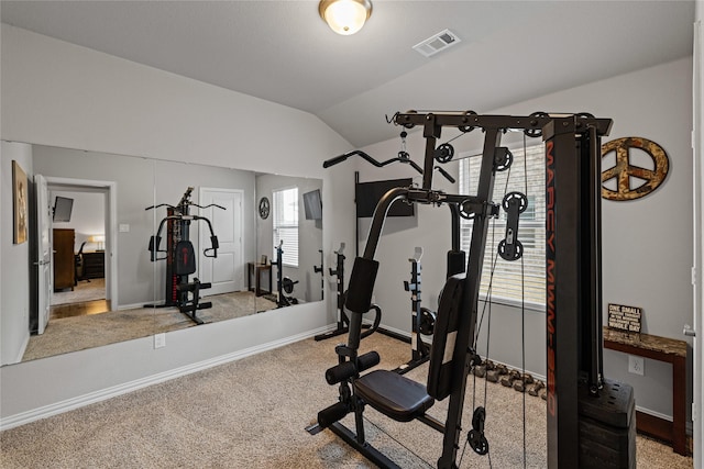 workout area with light colored carpet and lofted ceiling