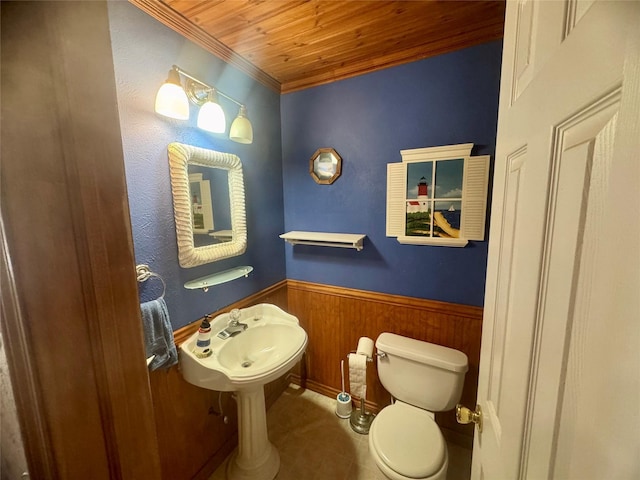 bathroom with sink, toilet, crown molding, and wooden ceiling