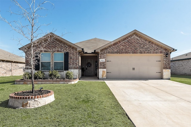 view of front of home with a front lawn and a garage