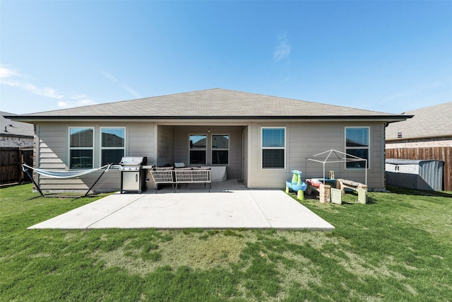 back of house featuring a yard, a patio area, and an outdoor living space