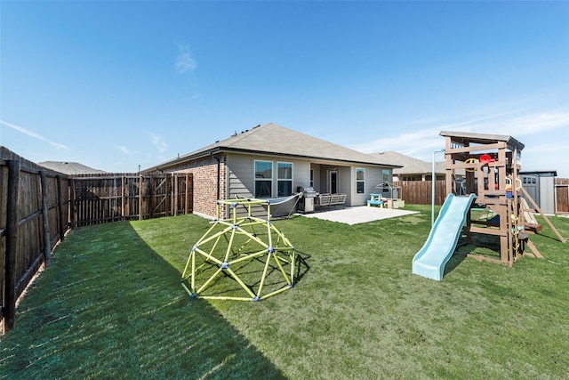 back of property with a playground, a patio area, and a lawn