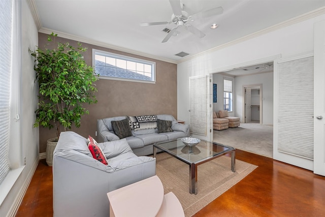 living room featuring ceiling fan and ornamental molding