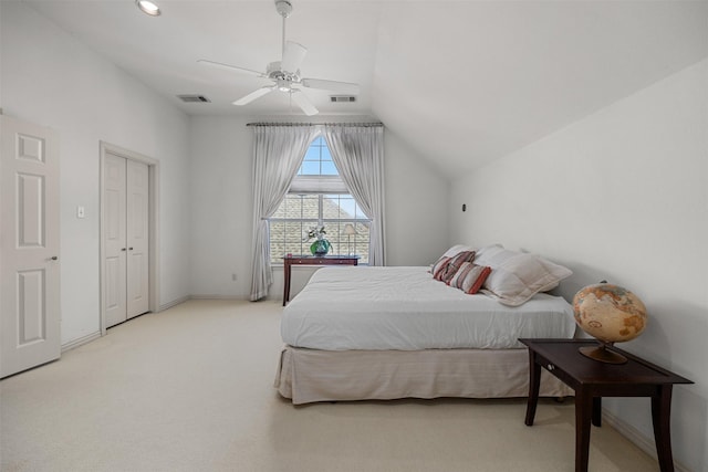 carpeted bedroom with lofted ceiling and ceiling fan