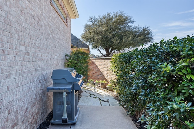 view of patio featuring a grill