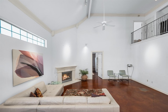 living room with high vaulted ceiling and crown molding