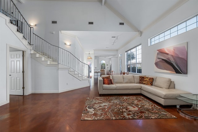 living room with high vaulted ceiling and crown molding