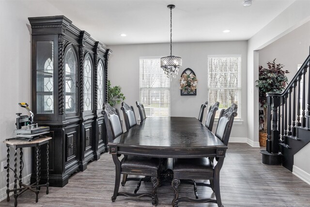 656 Calmwater Ct, Mabank, TX 75143 - dining room featuring stairs, wood finished floors, baseboards, an inviting chandelier, and recessed lighting