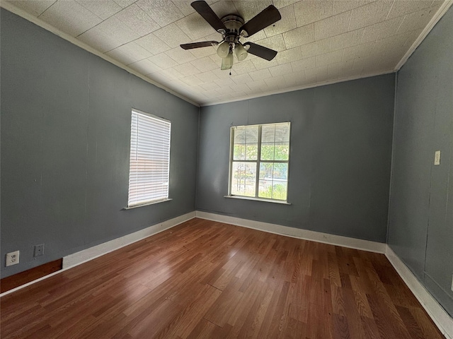 2917 Walnut St, Greenville, TX 75401 - unfurnished room with crown molding, wood finished floors, a ceiling fan, and baseboards