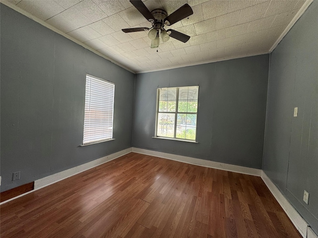 2917 Walnut St, Greenville, TX 75401 - spare room featuring ornamental molding, wood finished floors, and a ceiling fan