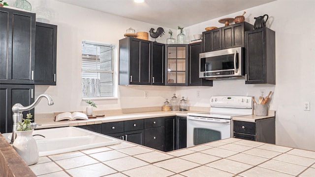 kitchen with sink and white electric stove