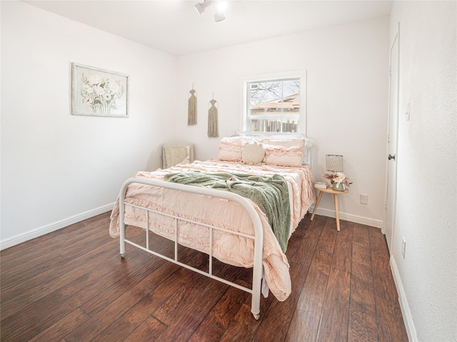 bedroom featuring dark wood-type flooring