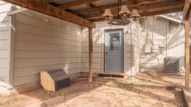 doorway to property featuring central AC unit