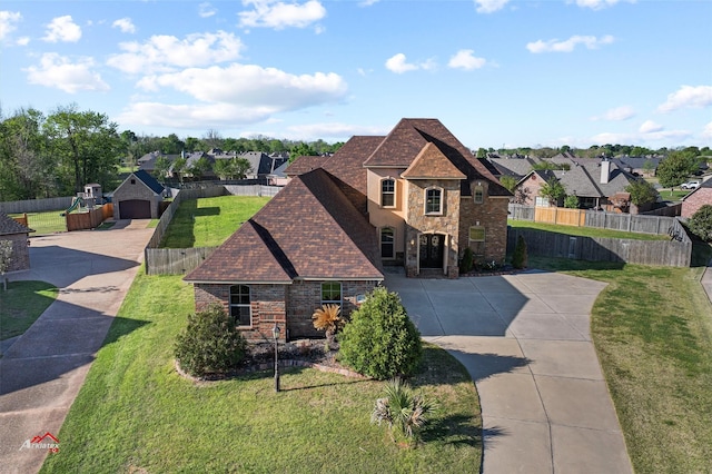 view of front of home featuring a front lawn and a garage