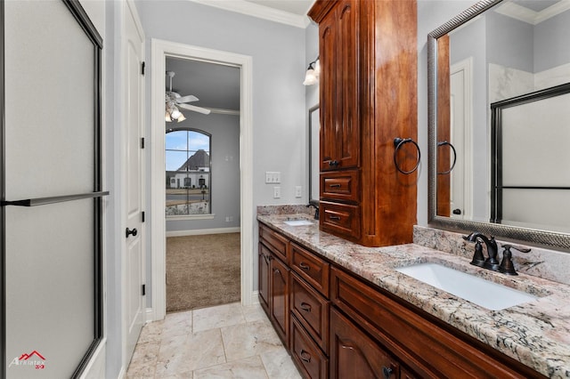 bathroom featuring ceiling fan, vanity, an enclosed shower, and ornamental molding